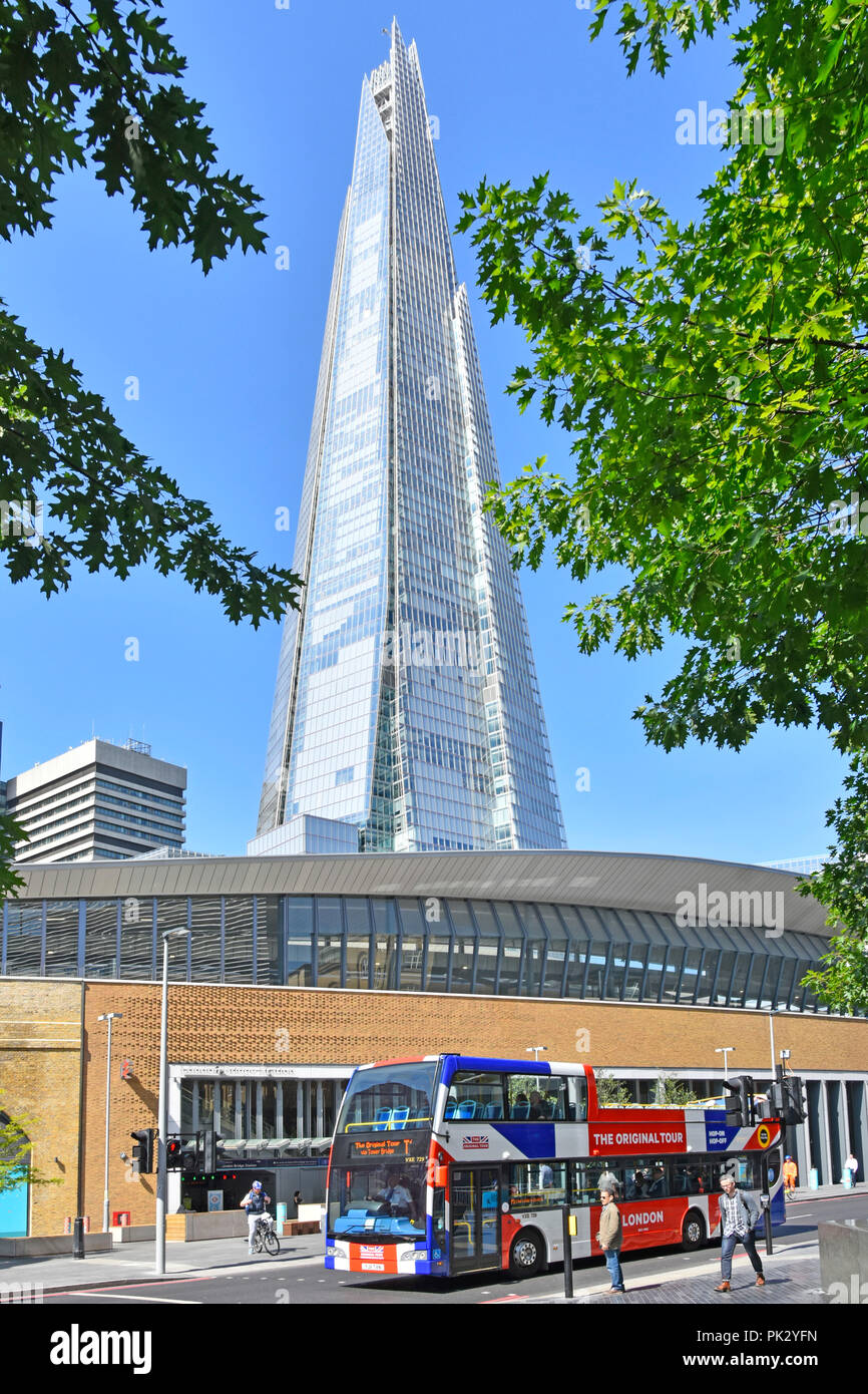 Open top double decker red white and blue London sightseeing tour bus & The Shard landmark skyscraper building Tooley Street Southwark South London UK Stock Photo