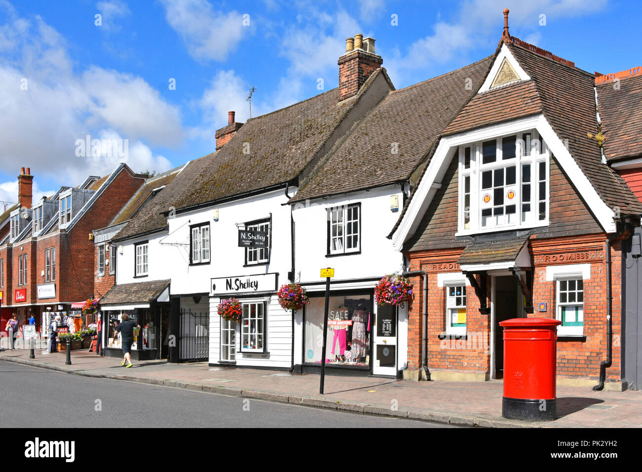 Billericay shopping high street with small retail business shop front window display & historic gable end reading room facade of 1886 Essex England UK Stock Photo