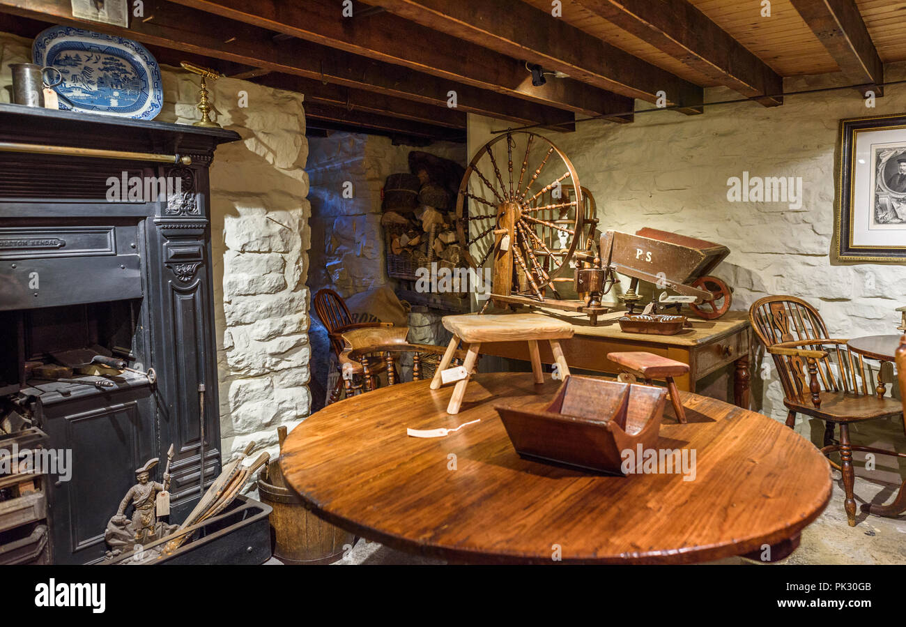 Antiques for sale in the room of an old stone building in Yorkshire. Stock Photo
