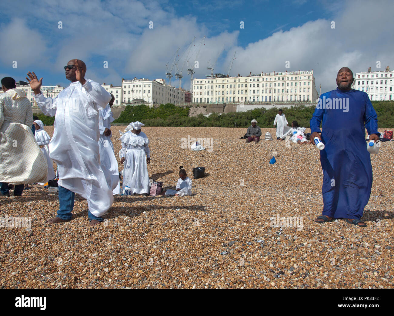 Members of an African Baptist Church gather on the beach at Brighton to