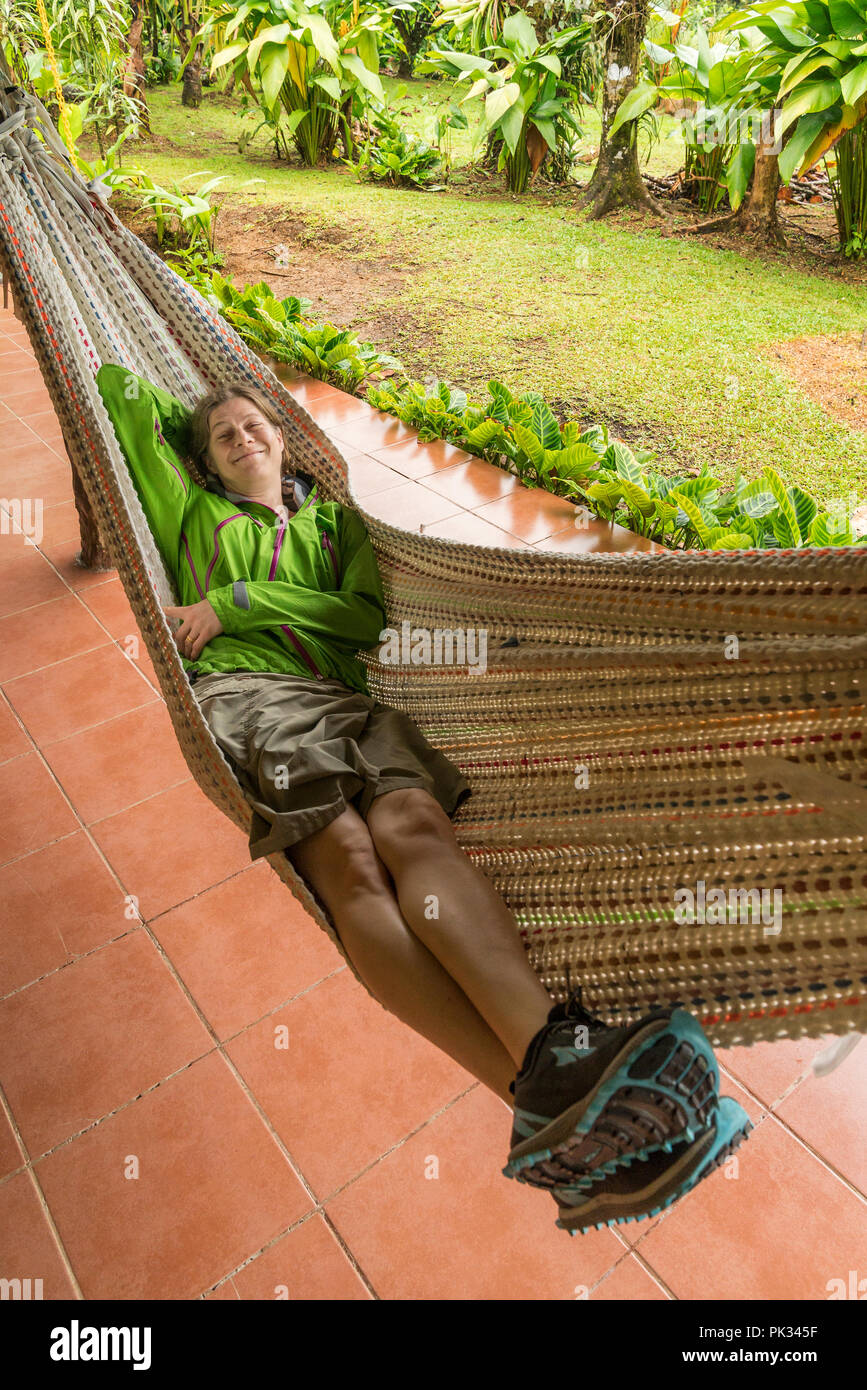 Woman in a hammock, Mirador El Silencio Hotel, San Carlos, Costa Rica Stock Photo