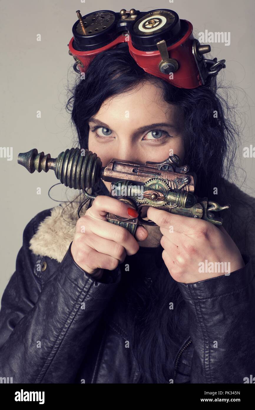 headshot dieselpunk girl with ray gun Stock Photo - Alamy