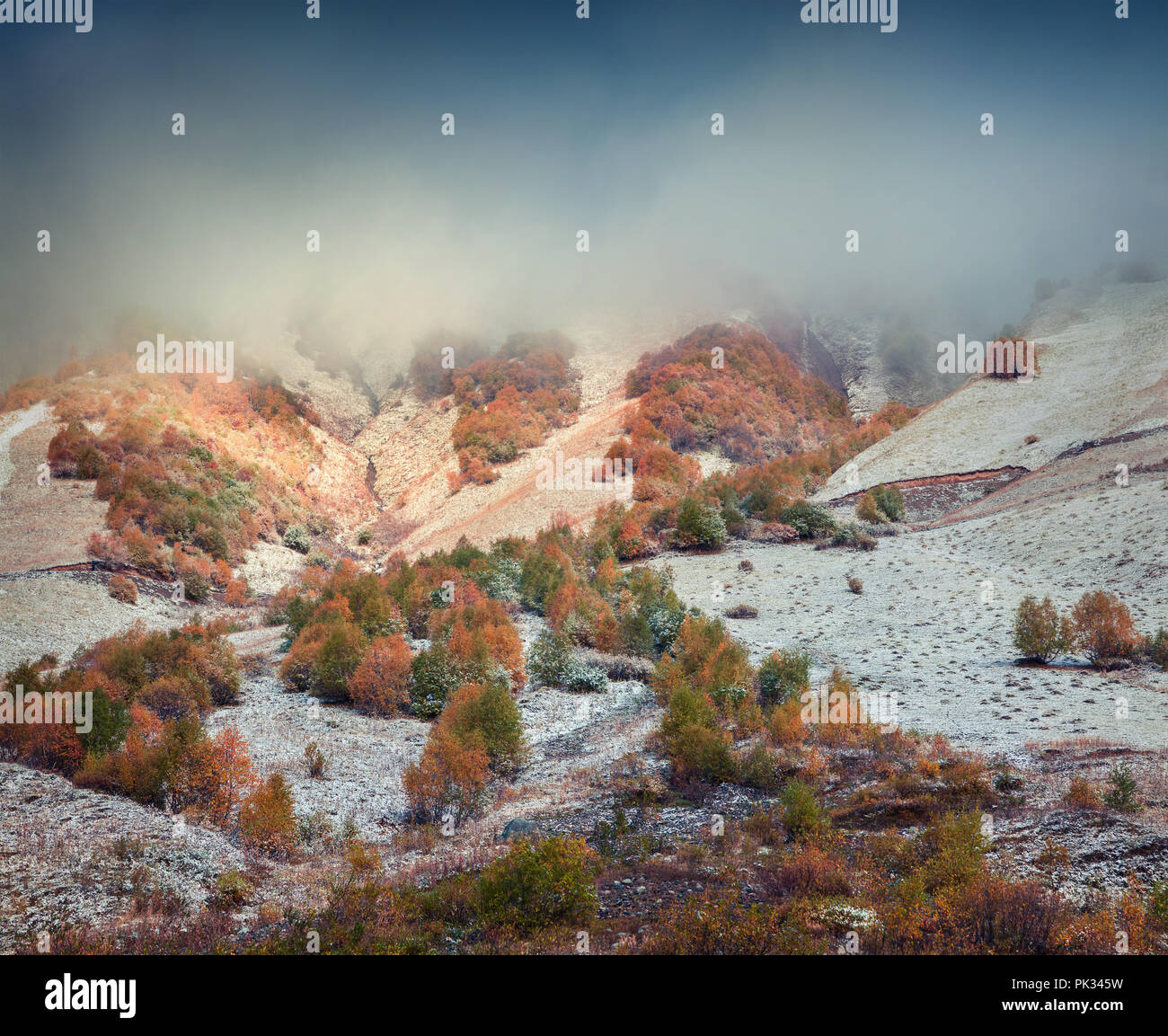 Snow-covered mountain slope in Caucasus mountains. First October snow. Upper Svaneti, Georgia, Europe. October 2015. Stock Photo
