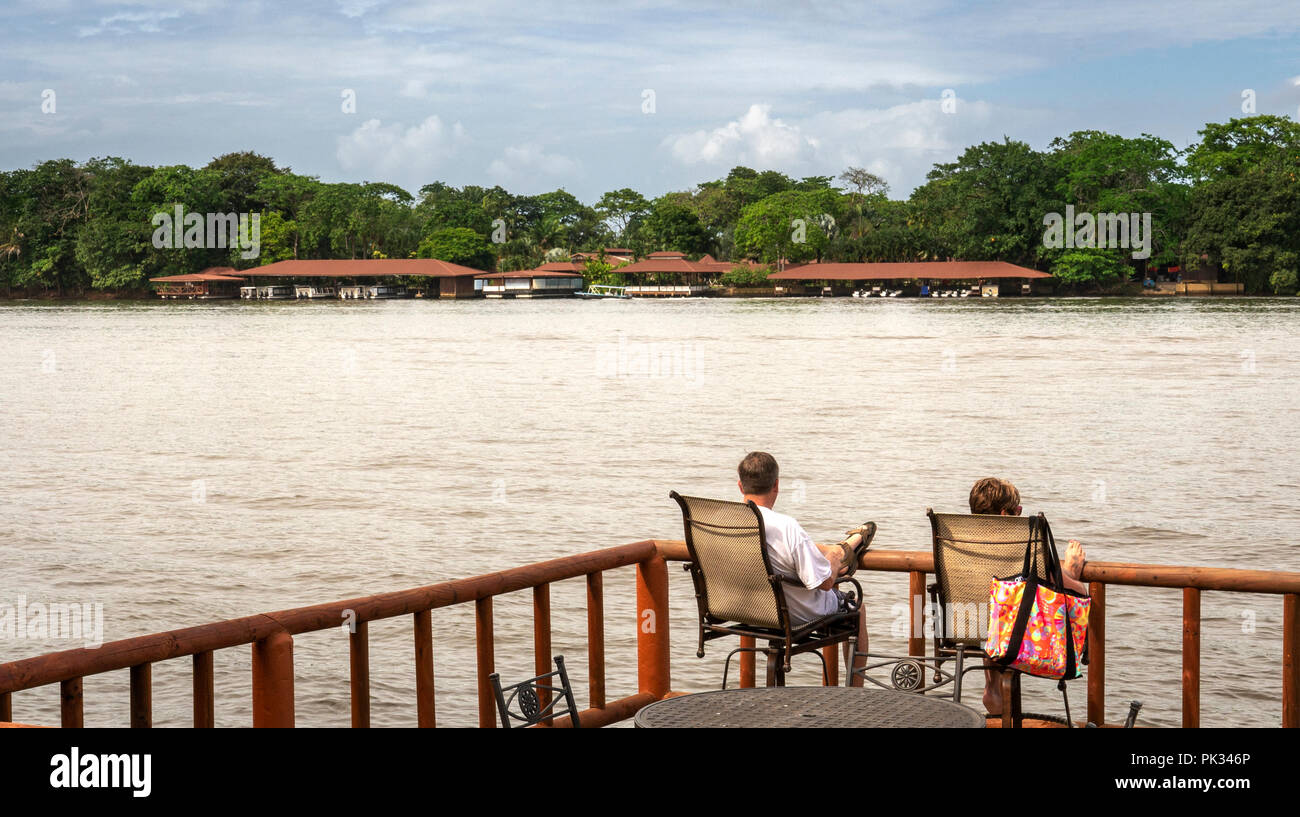 Couple on the deck at Pachira Lodge, Costa Rica Stock Photo