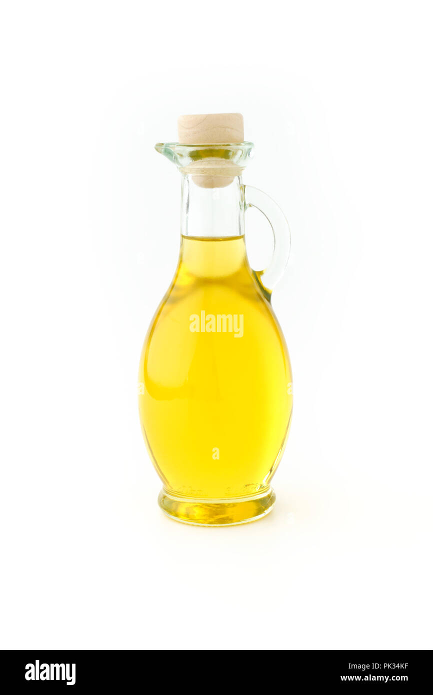 Extra virgin olive oil in a beautiful glass bottle on white background. Stock Photo