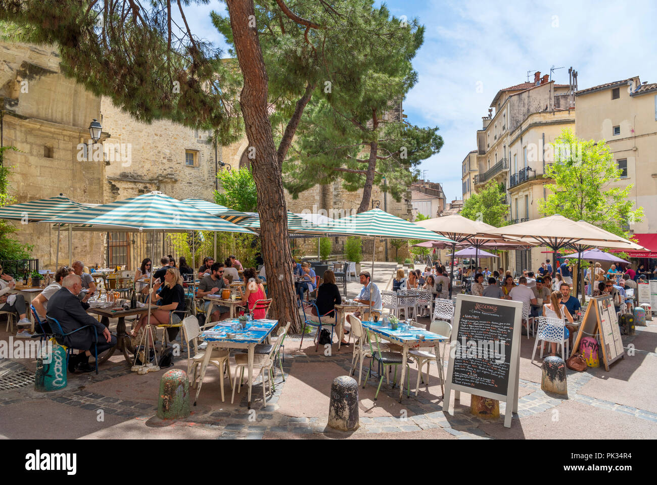 Cafes and restaurants on Rue Saint-Paul in the historic old town, Montpellier, Languedoc, France Stock Photo