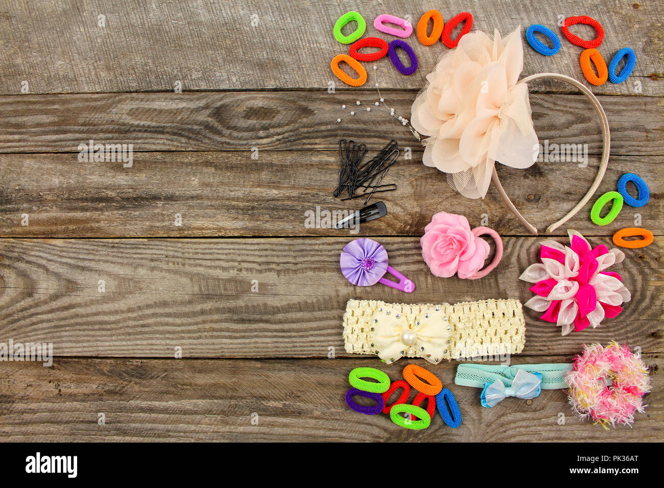 Different hair clips on wooden background. Top view. Stock Photo
