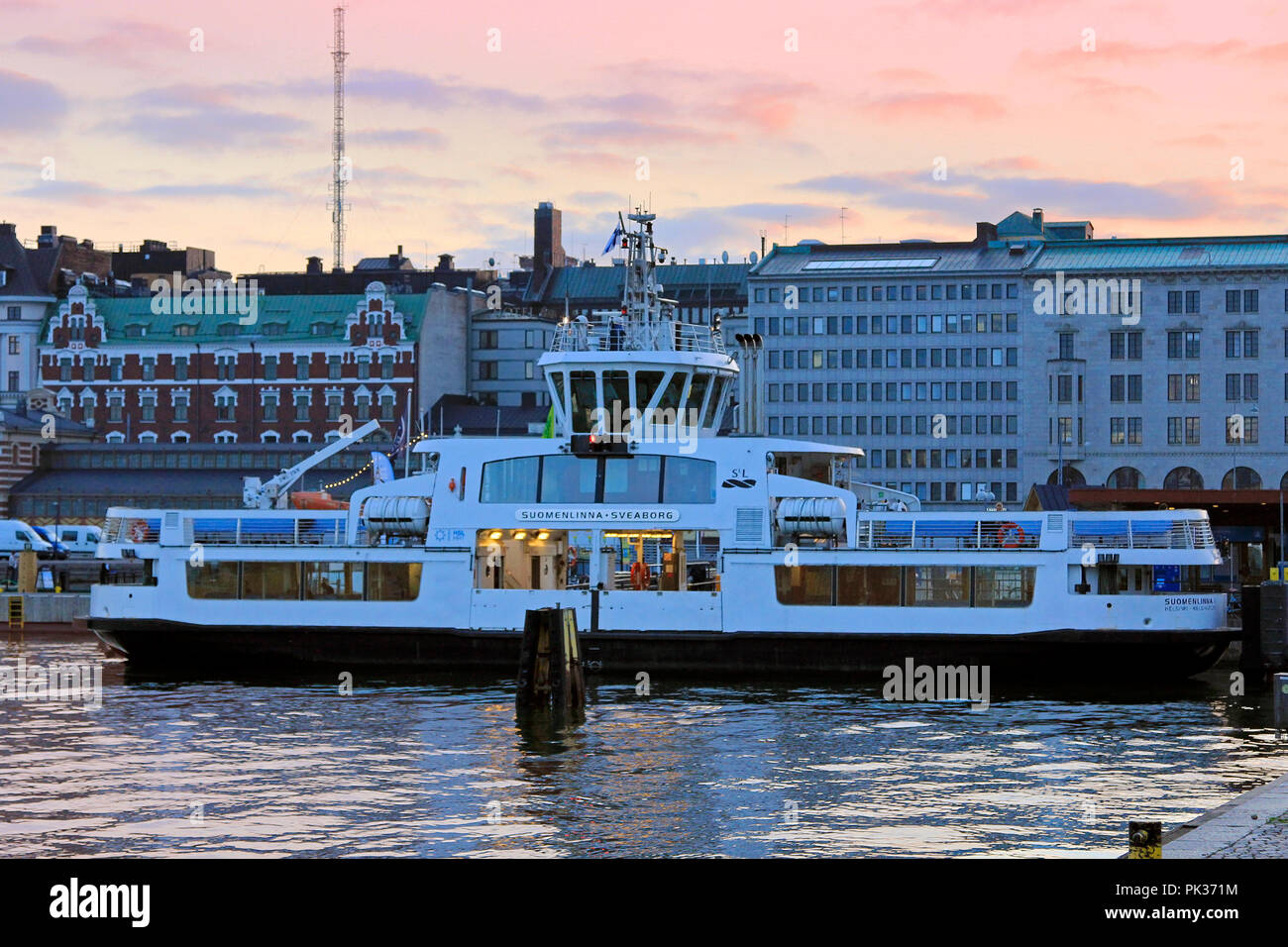 HSL ferry to Suomenlinna Sea Fortress at Market Square in autumn at sunset time. Helsinki, Finland - September 5, 2018. Stock Photo
