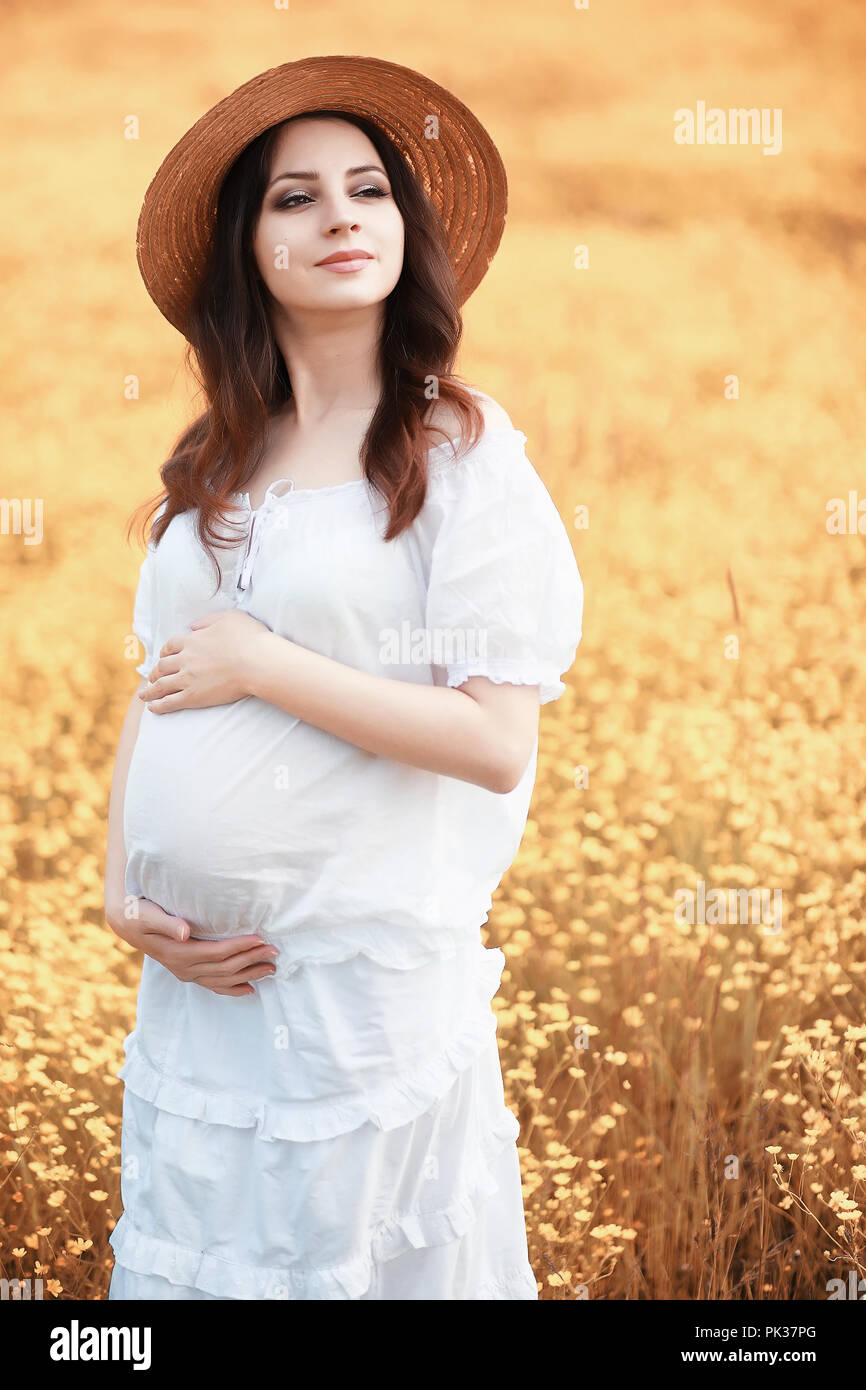 Pregnant woman in nature for a walk in the autumn Stock Photo - Alamy