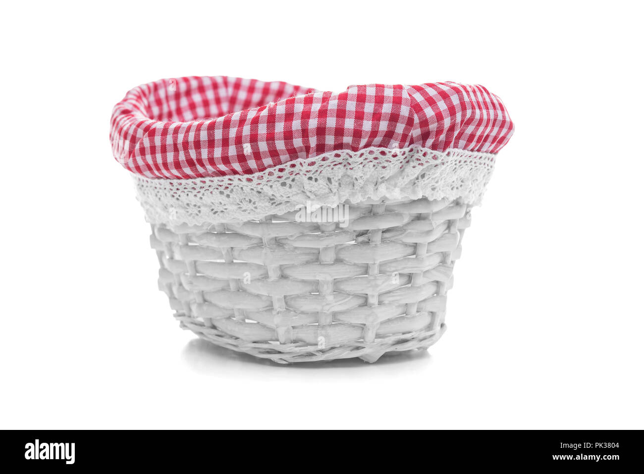 White wicker basket on a white background. Stock Photo