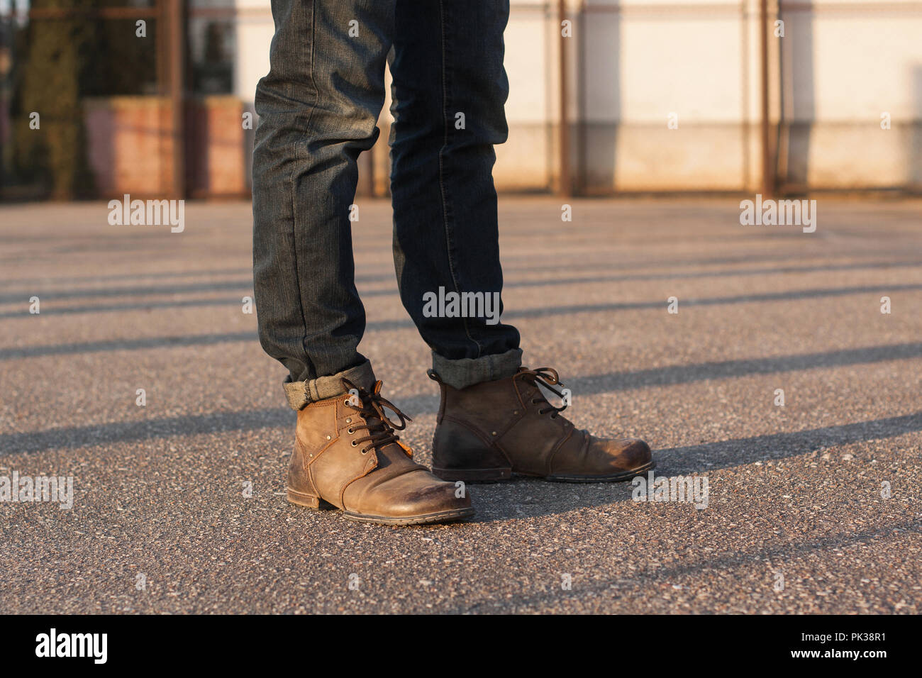 Men's legs with jeans and boots. at Stock Photo -