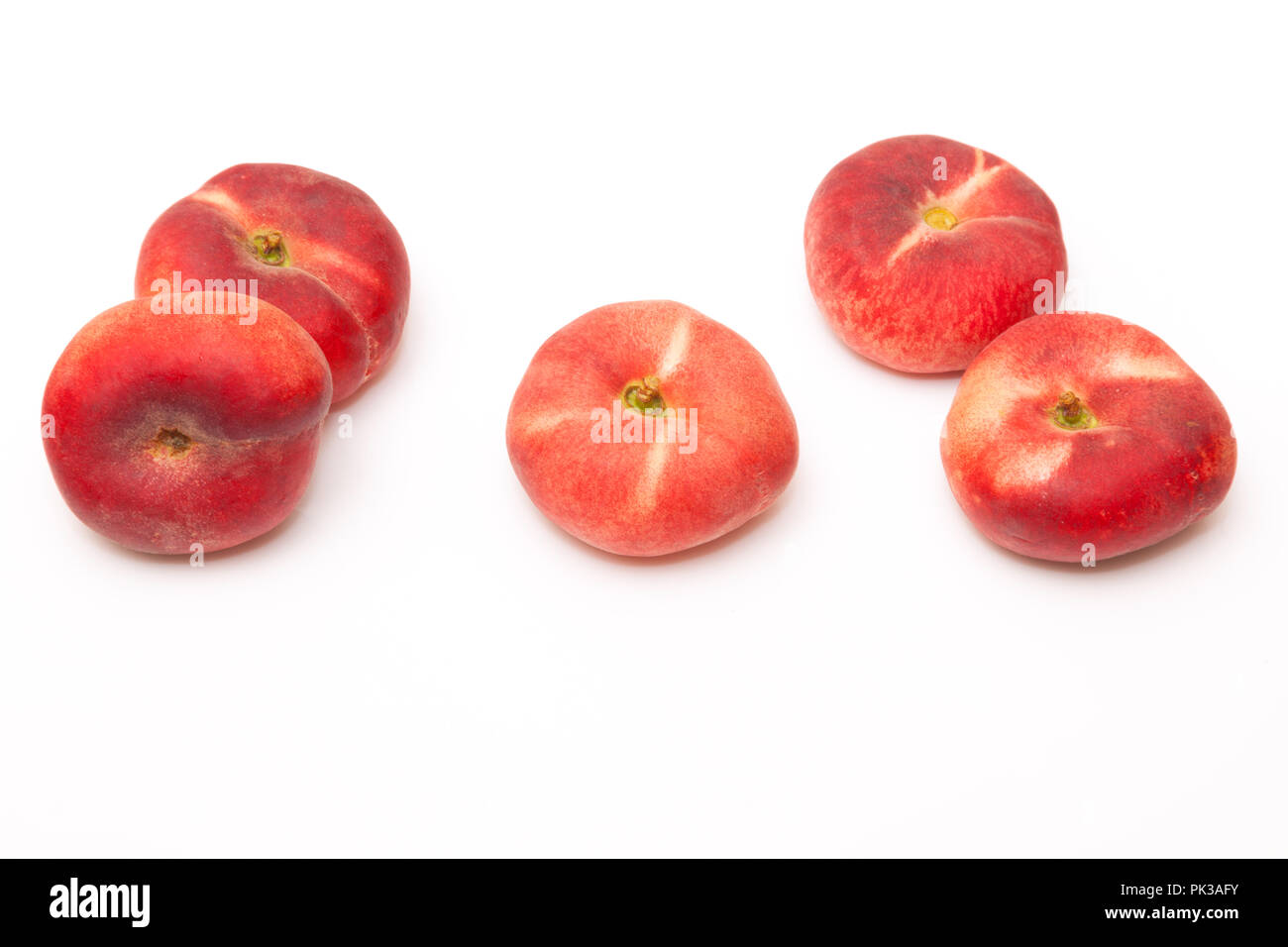 Flat peaches Saturn peach isolated on a  white studio background. Stock Photo