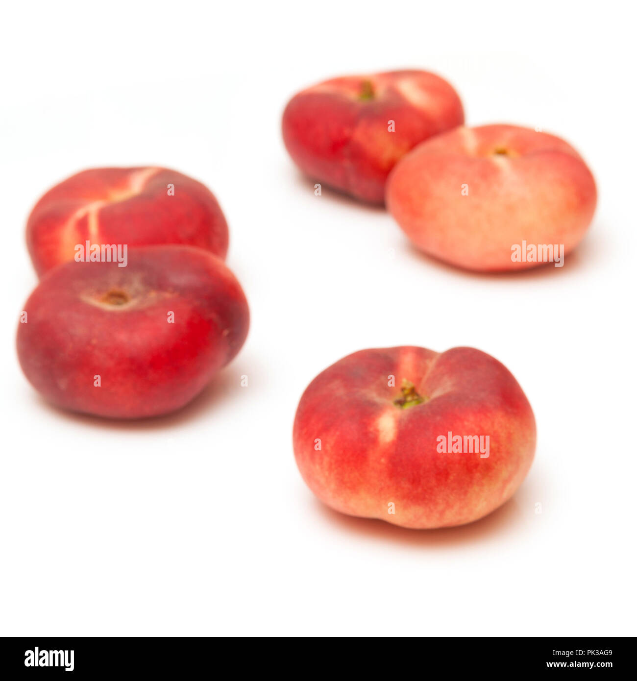 Flat peaches Saturn peach isolated on a white studio background Stock