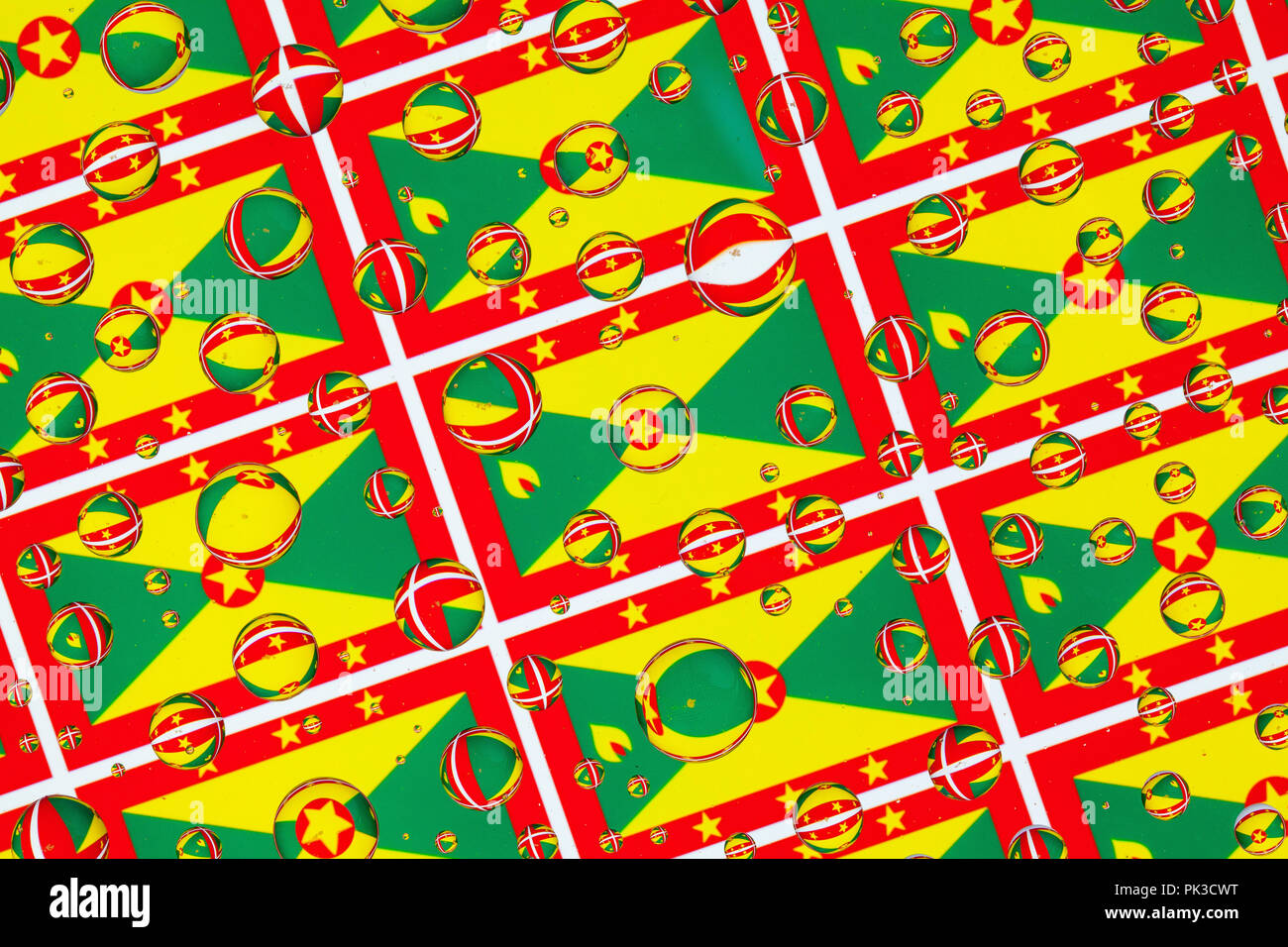 Flags of Grenada, behind a glass covered with rain drops.Pattern from ...