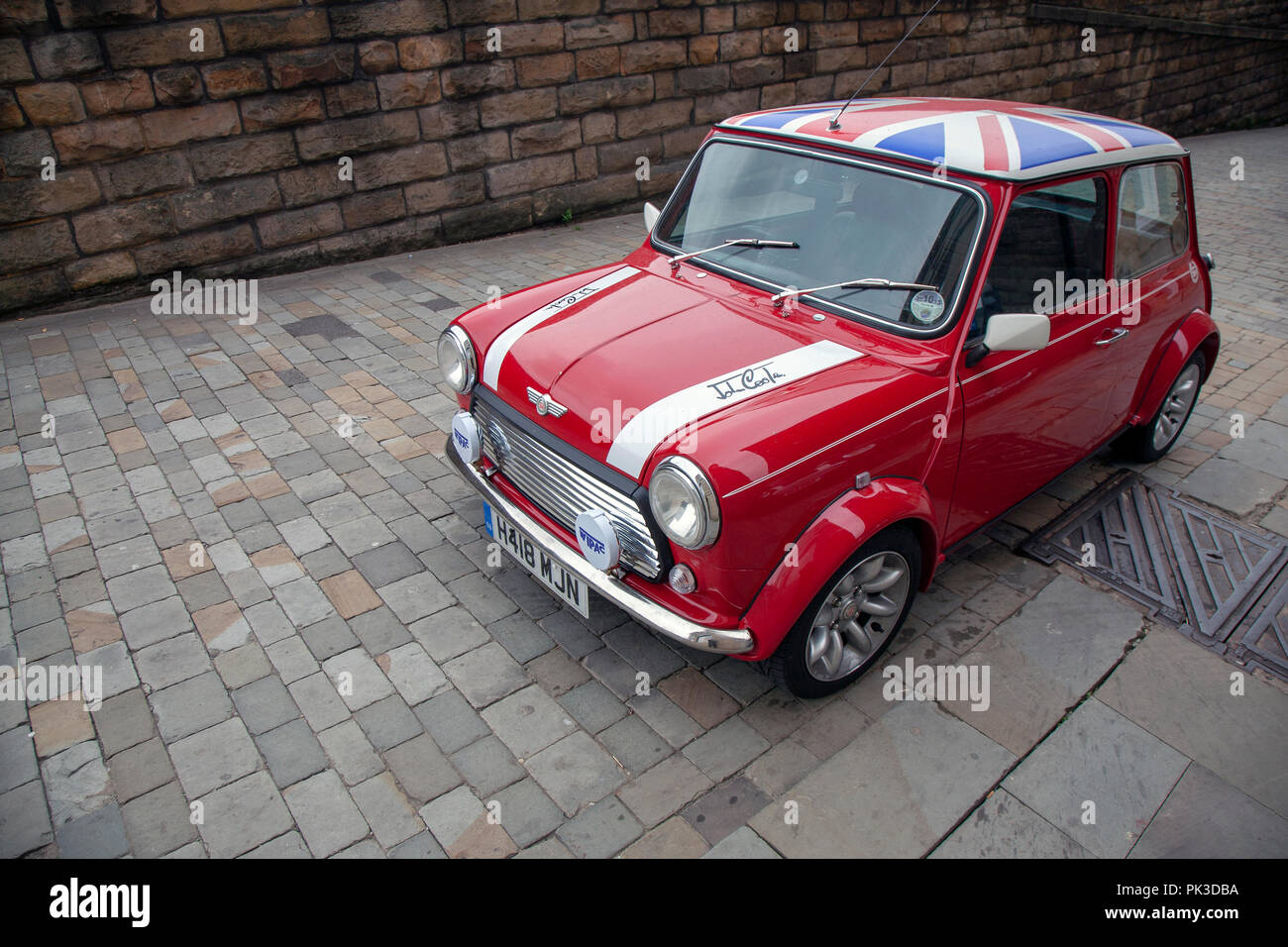 A Red Mini Cooper wth a Union Jack Roof by John Cooper version of