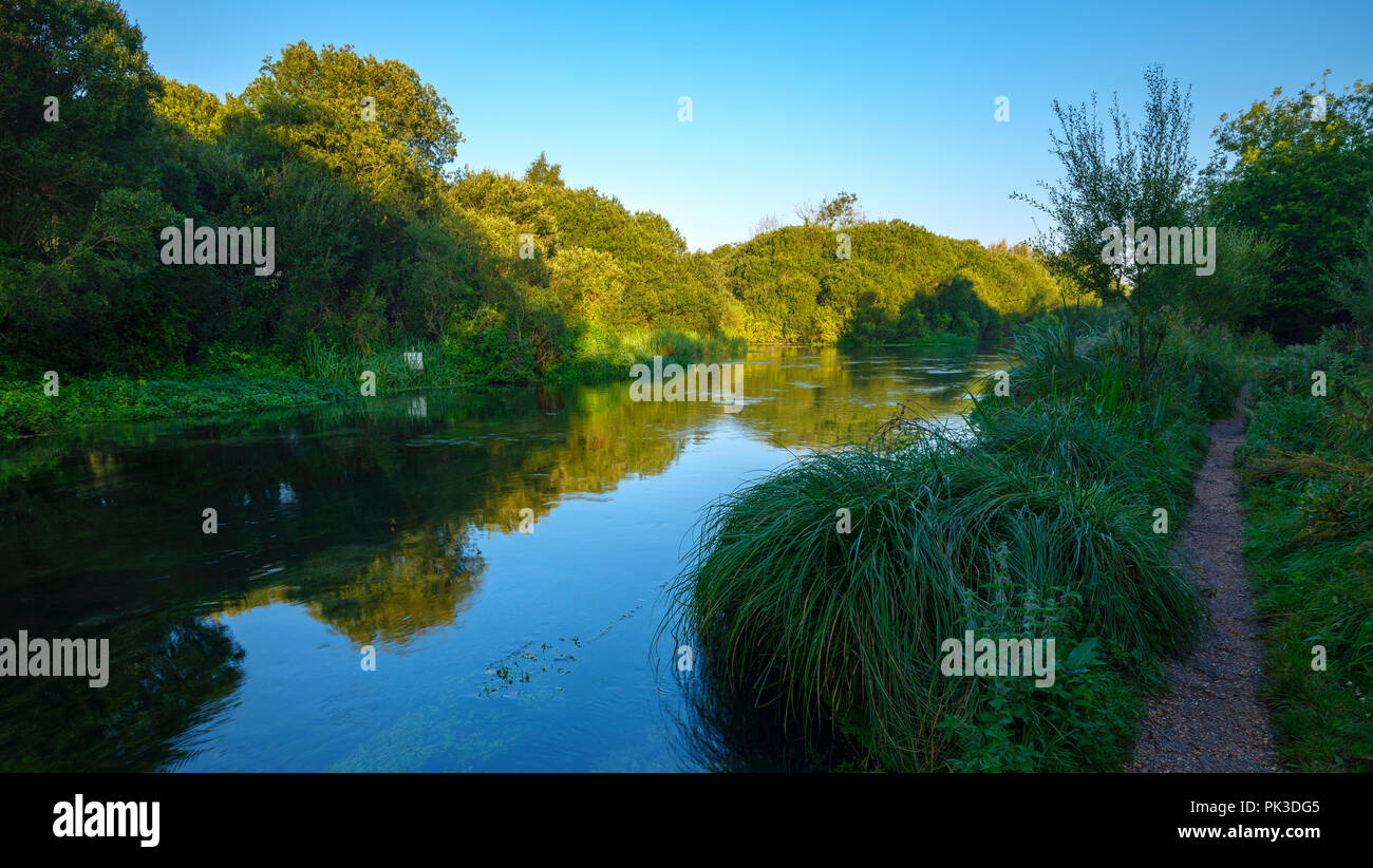 Autumn sunrise on the River Itchen - a famous chalk bed stream renowned for fly fishing - between Ovington and Itchen Abbas in Hampshire, UK. Stock Photo