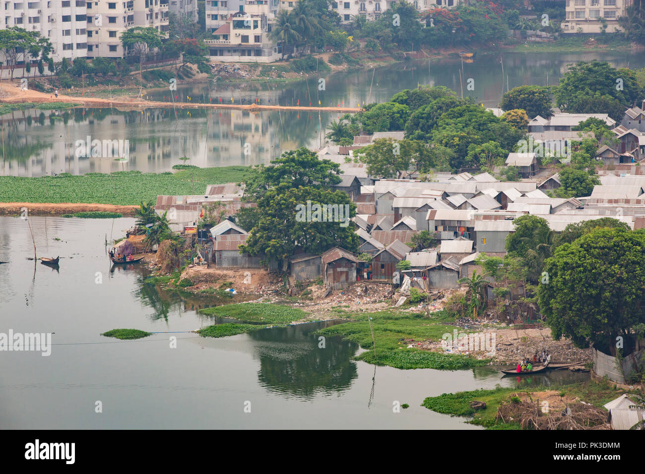 A view looking down on a slum on the banks of a river in Dhaka, Bangladesh Stock Photo