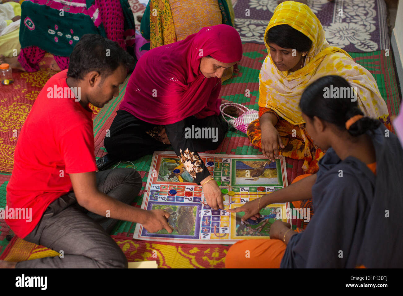 Women playing a board game during a workshop in Dhaka, Bangladesh. Stock Photo