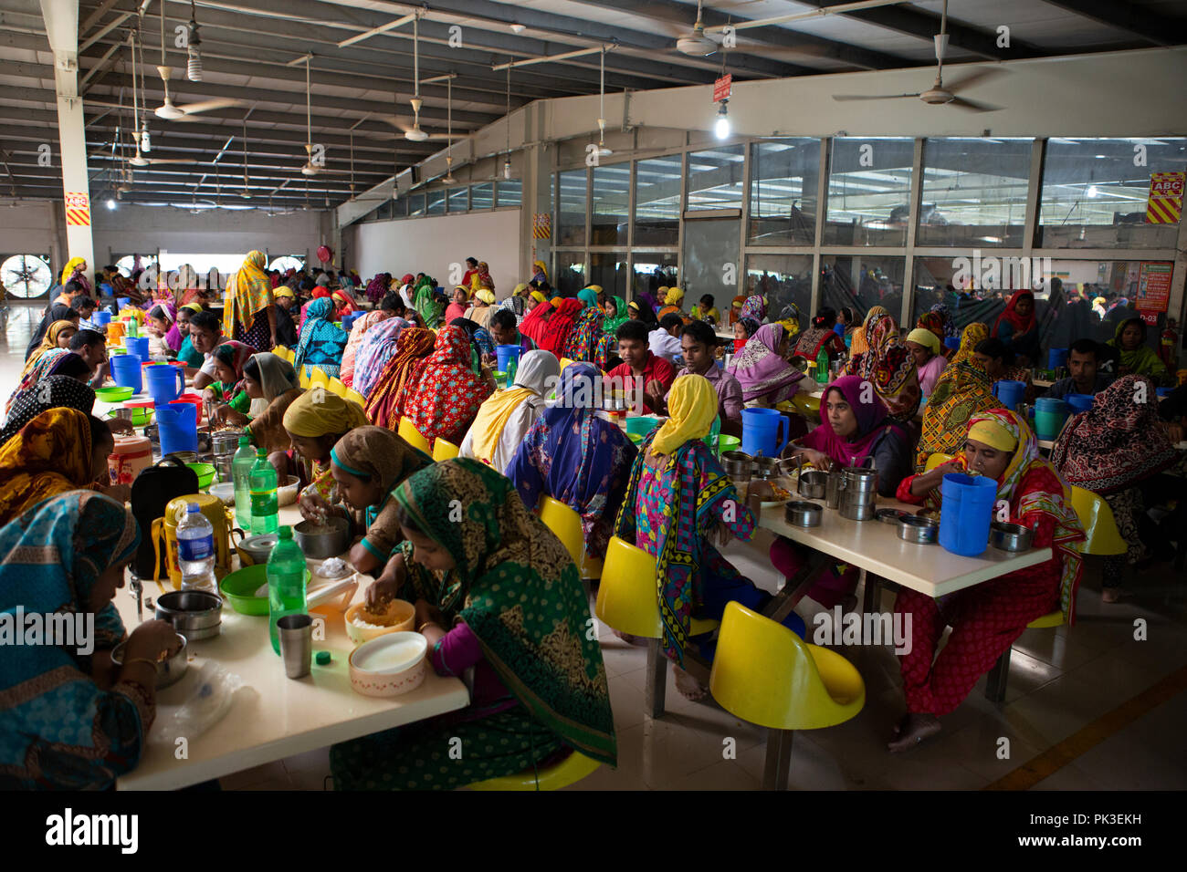 Garment workers having their lunch in the canteen at a garment factory