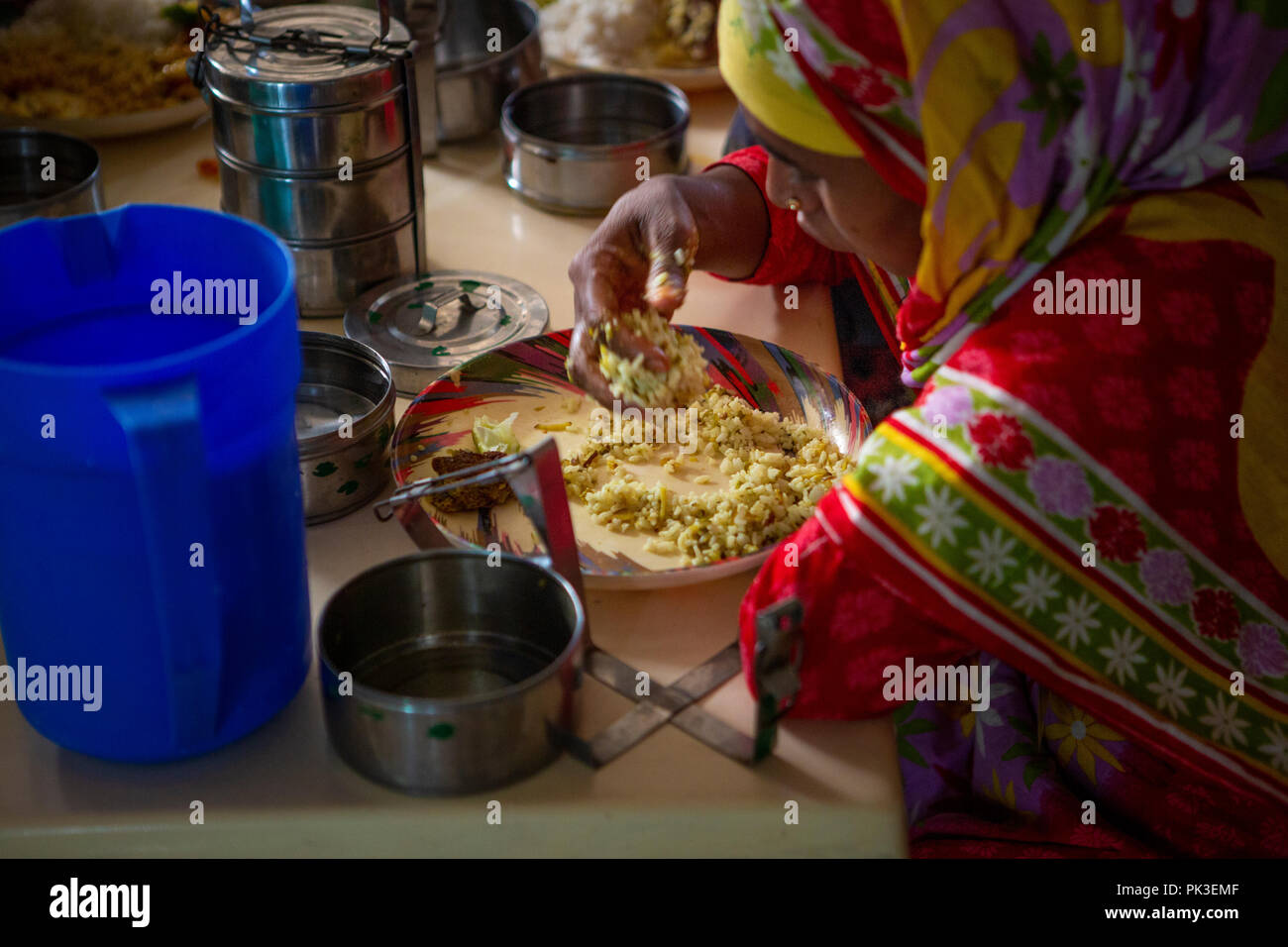 Garment workers having their lunch in the canteen at a garment factory