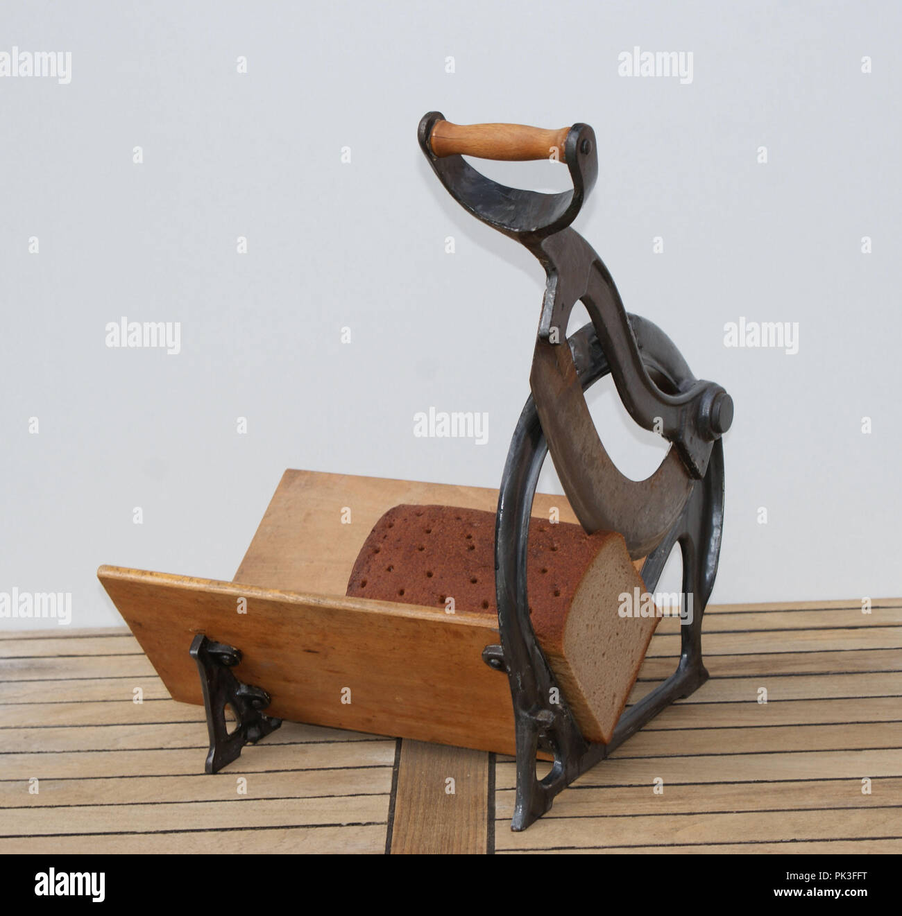 Vintage bread slicer with a country bread Stock Photo Alamy