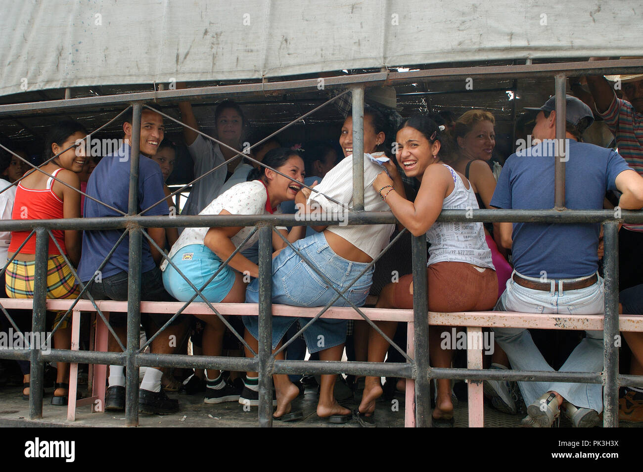 HAVANA, CUBA-MAY 05, 2016: Group of unidentified people in a open truck. In 2004, the public transportation system is non existing in Cuba, only a few Stock Photo