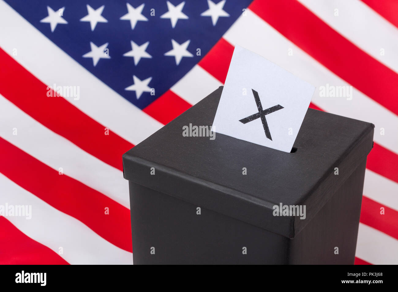 Black ballot box + American  US Stars and Stripes. US Presidential, midterm elections, US Primaries, voter registration, voter turnout, election USA. Stock Photo
