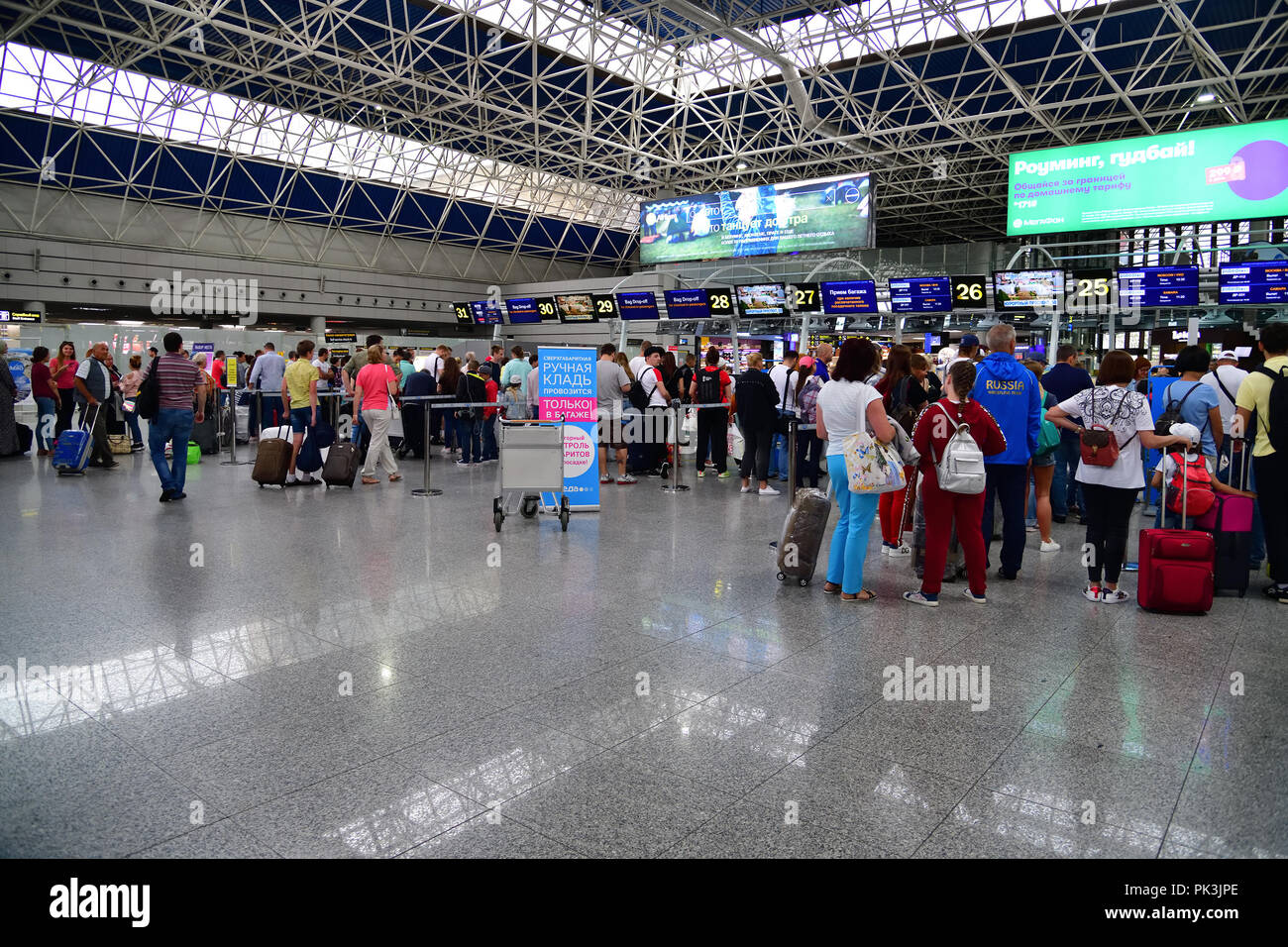 Sochi, Russia - June 6. 2018. queue to registration desks of airline Pobeda in an international airport Adler Stock Photo