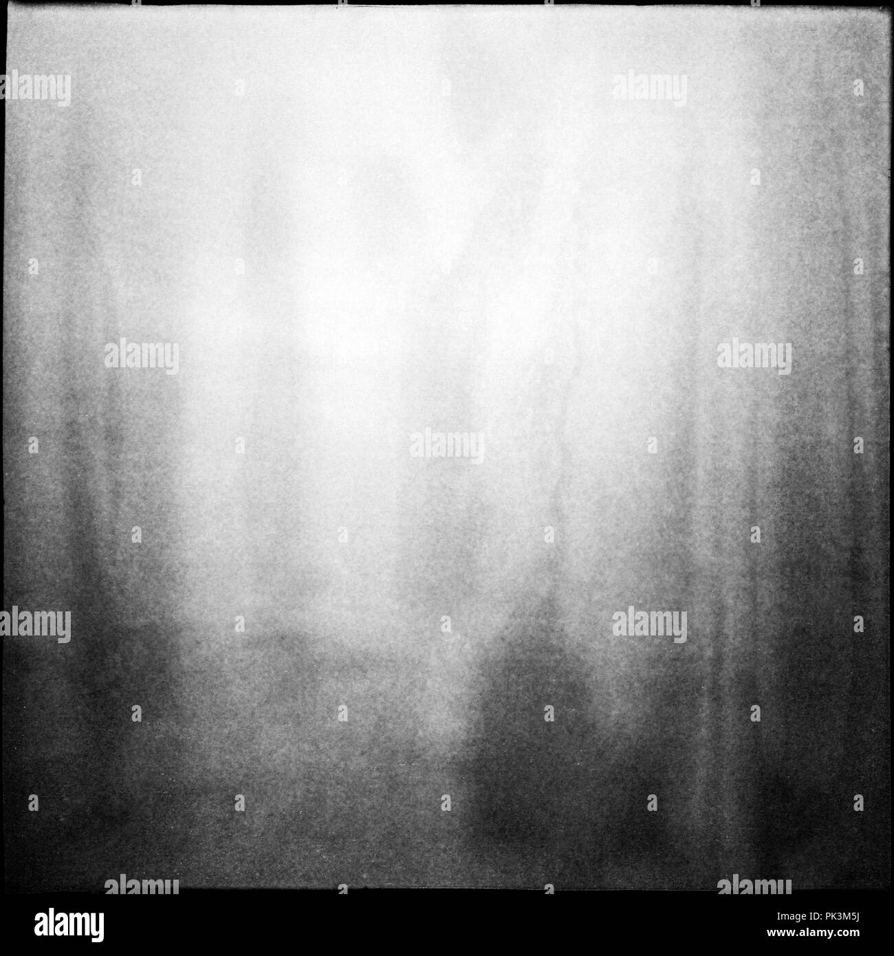 Black and white medium format film background with grain and light leak