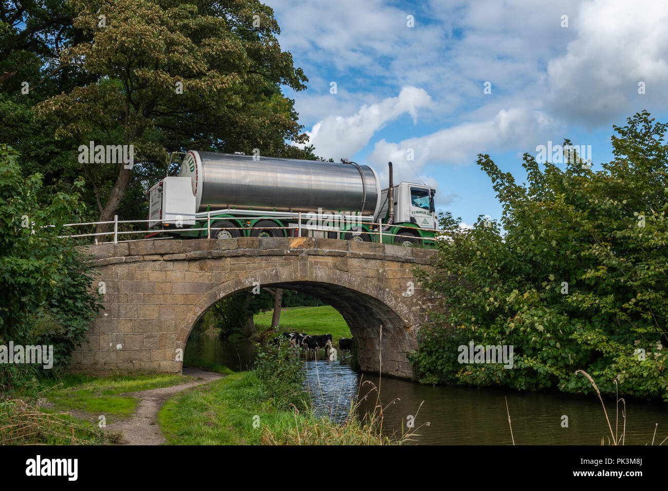 Milk wagon crossing a bridge over the Lancaster Canal at Forton Stock Photo