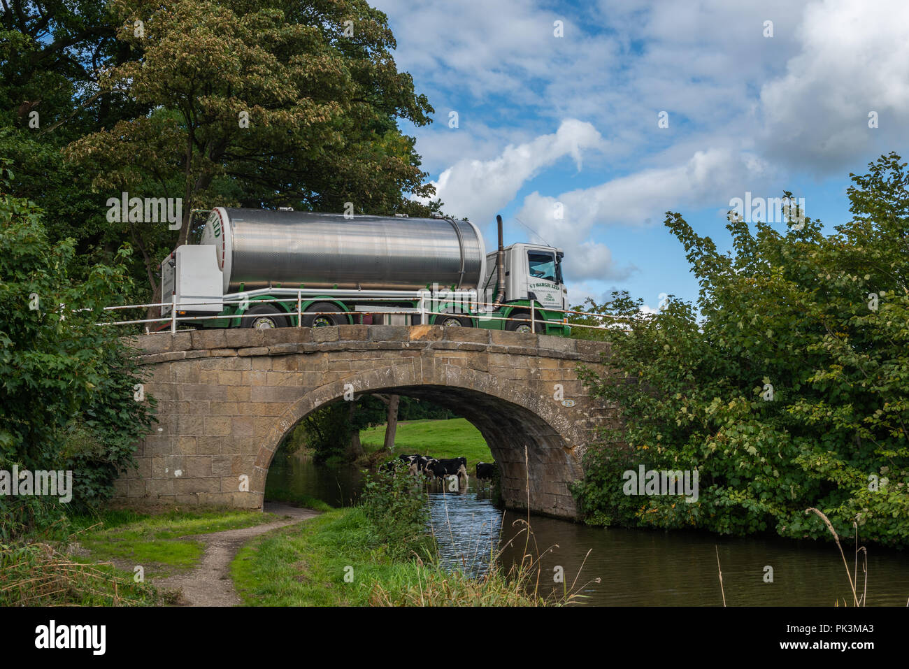 Milk wagon crossing a bridge over the Lancaster Canal at Forton Stock Photo