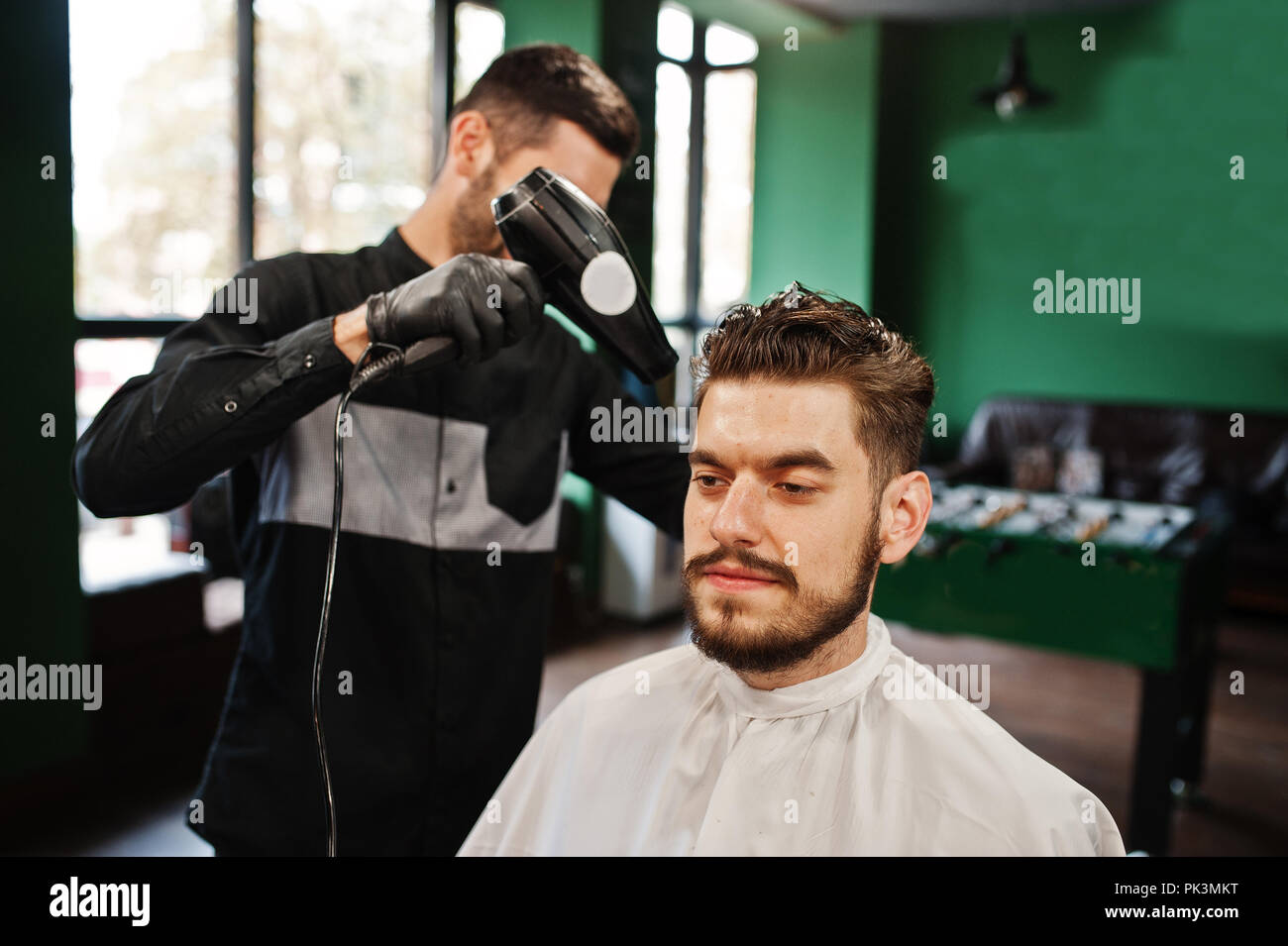 Barber shop using hair dryer hi-res stock photography and images - Alamy