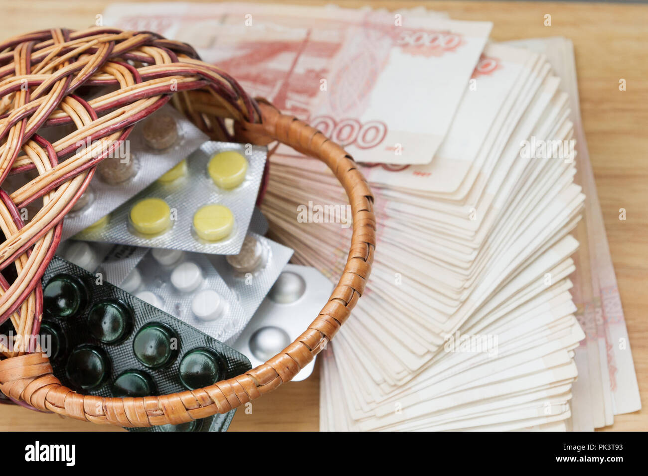 Pills and medicines are in the basket next to the big Russian money ...