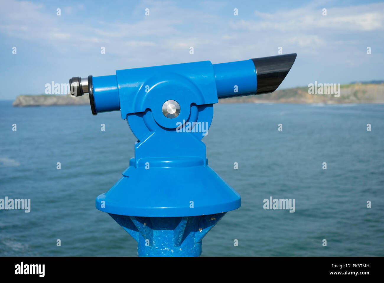 Coin operated binocular on the summer beach, tourist scene in Spain ...