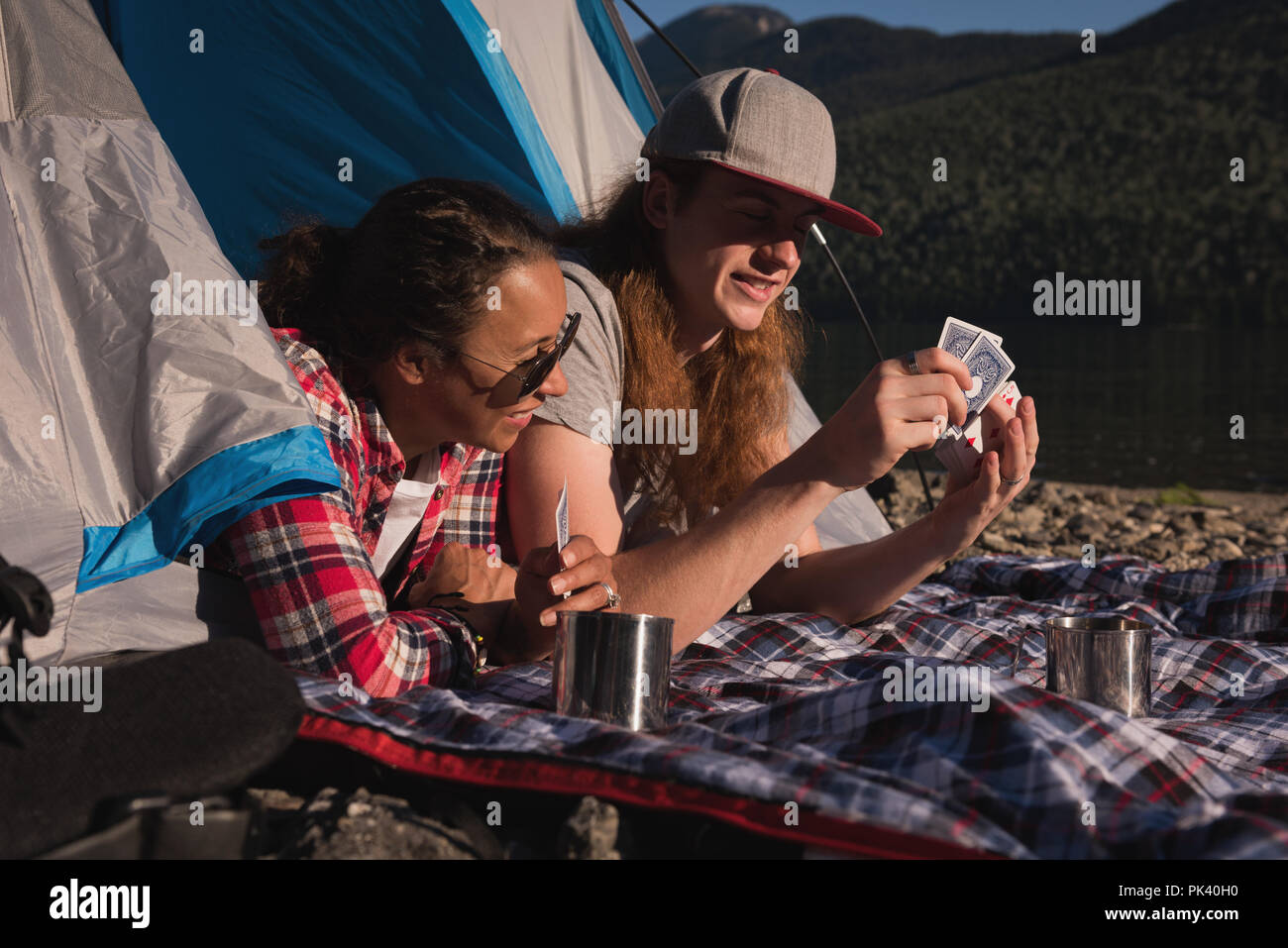 Couple playing with playing cards Stock Photo