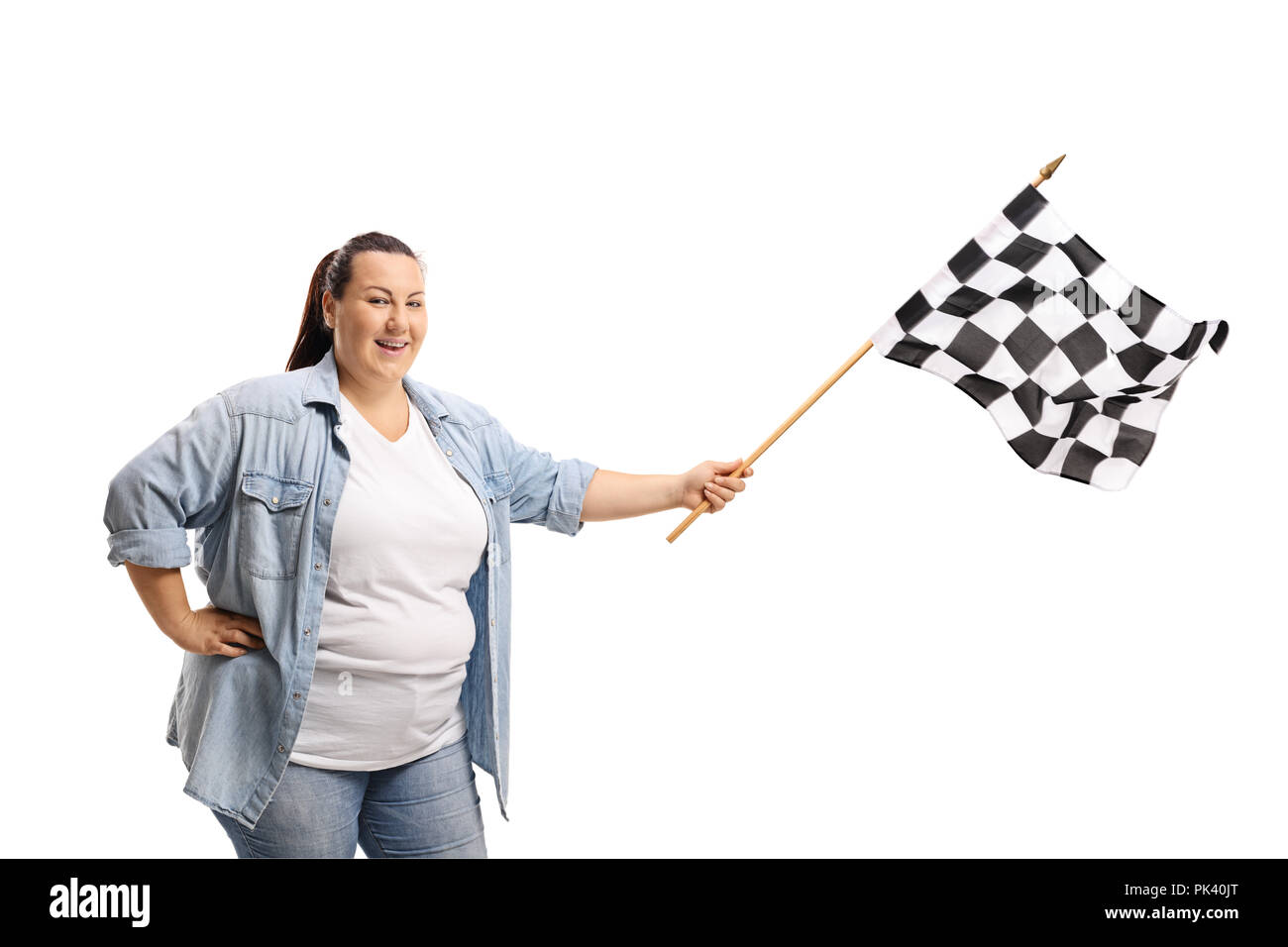 Woman waving a checkered race flag isolated on white background Stock Photo