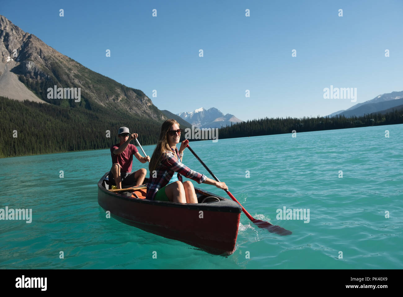Couple boating on river Stock Photo