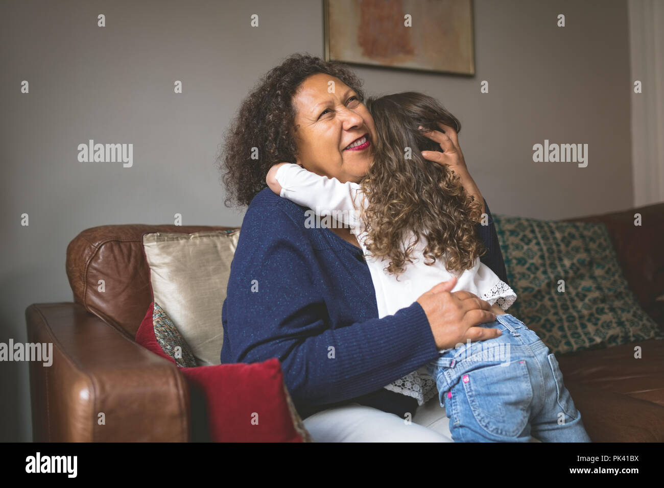 Little girl hugging grandmother Stock Photo