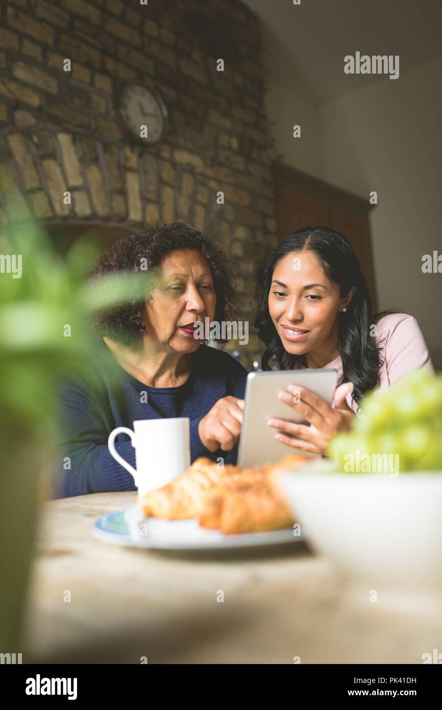 Mother and daughter using digital tablet Stock Photo