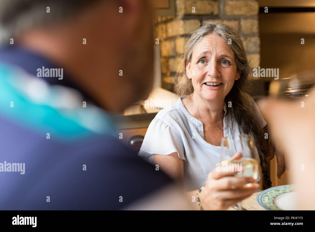 Senior couple interacting with each other on dining table Stock Photo