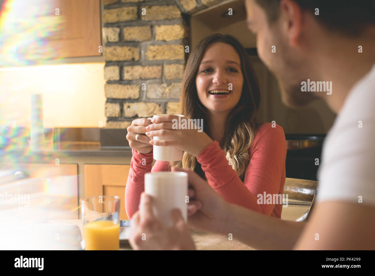 Couple interacting with each other while having coffee Stock Photo