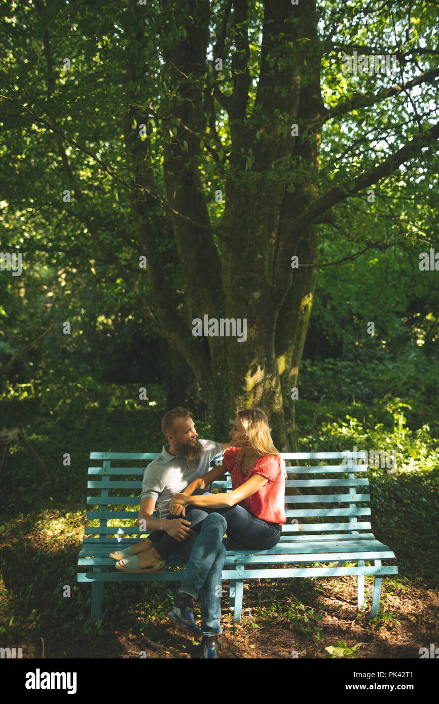 Couple relaxing in the park Stock Photo - Alamy