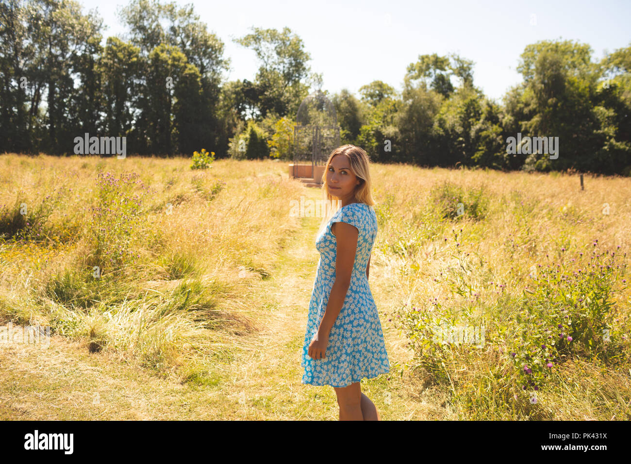 Woman standing outdoors in park hi-res stock photography and images - Alamy