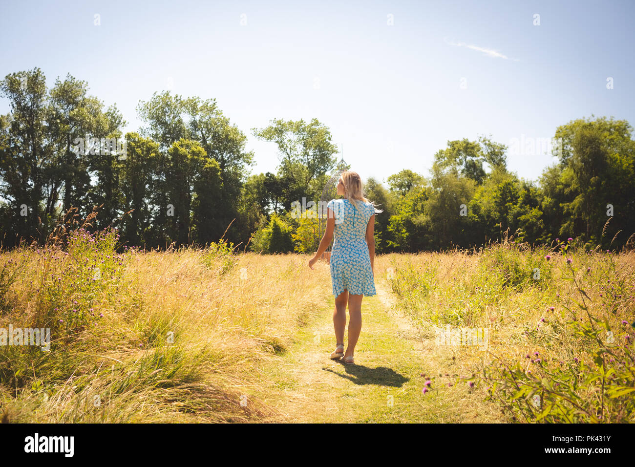 Walking park woman hi-res stock photography and images - Alamy