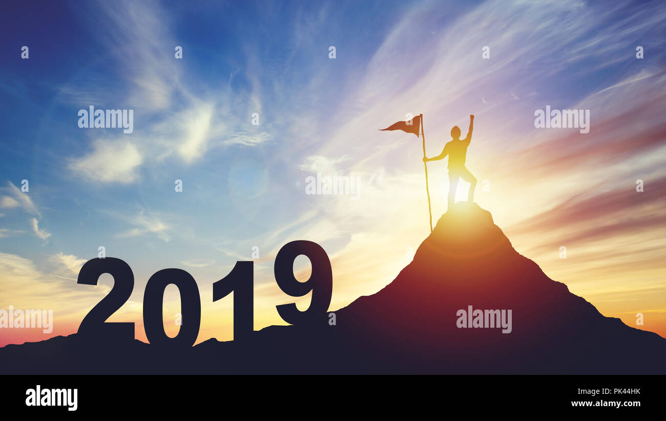 silhouette of man with flag on mountain top over sunset Stock Photo - Alamy