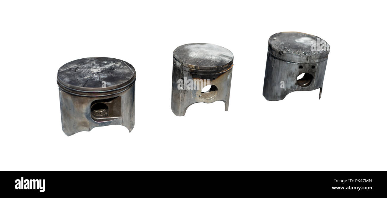 Burned, damaged car pistons. Isolated on a white background with a clipping path. Stock Photo