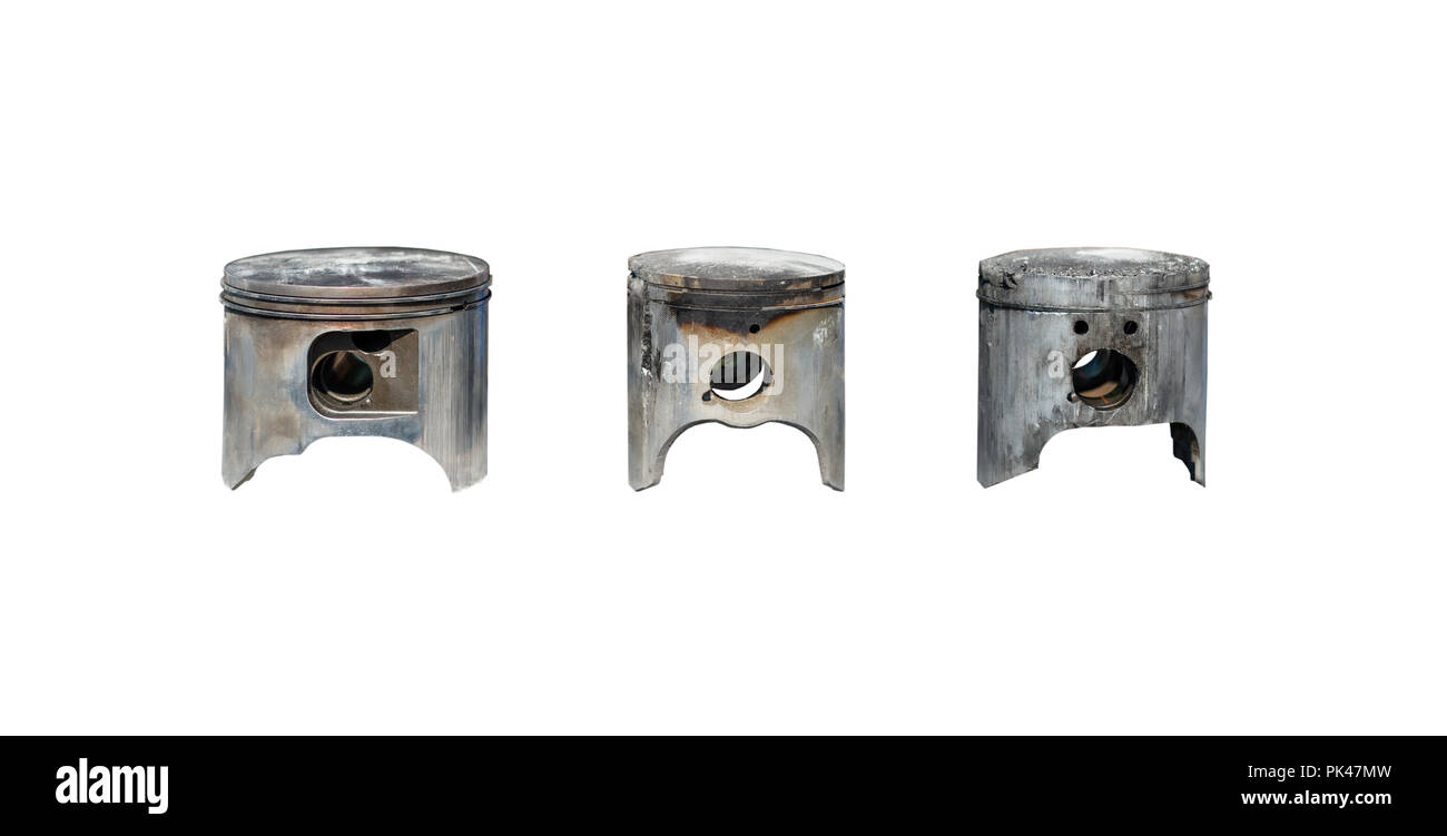 Burned, damaged car pistons. Isolated on a white background with a clipping path. Stock Photo