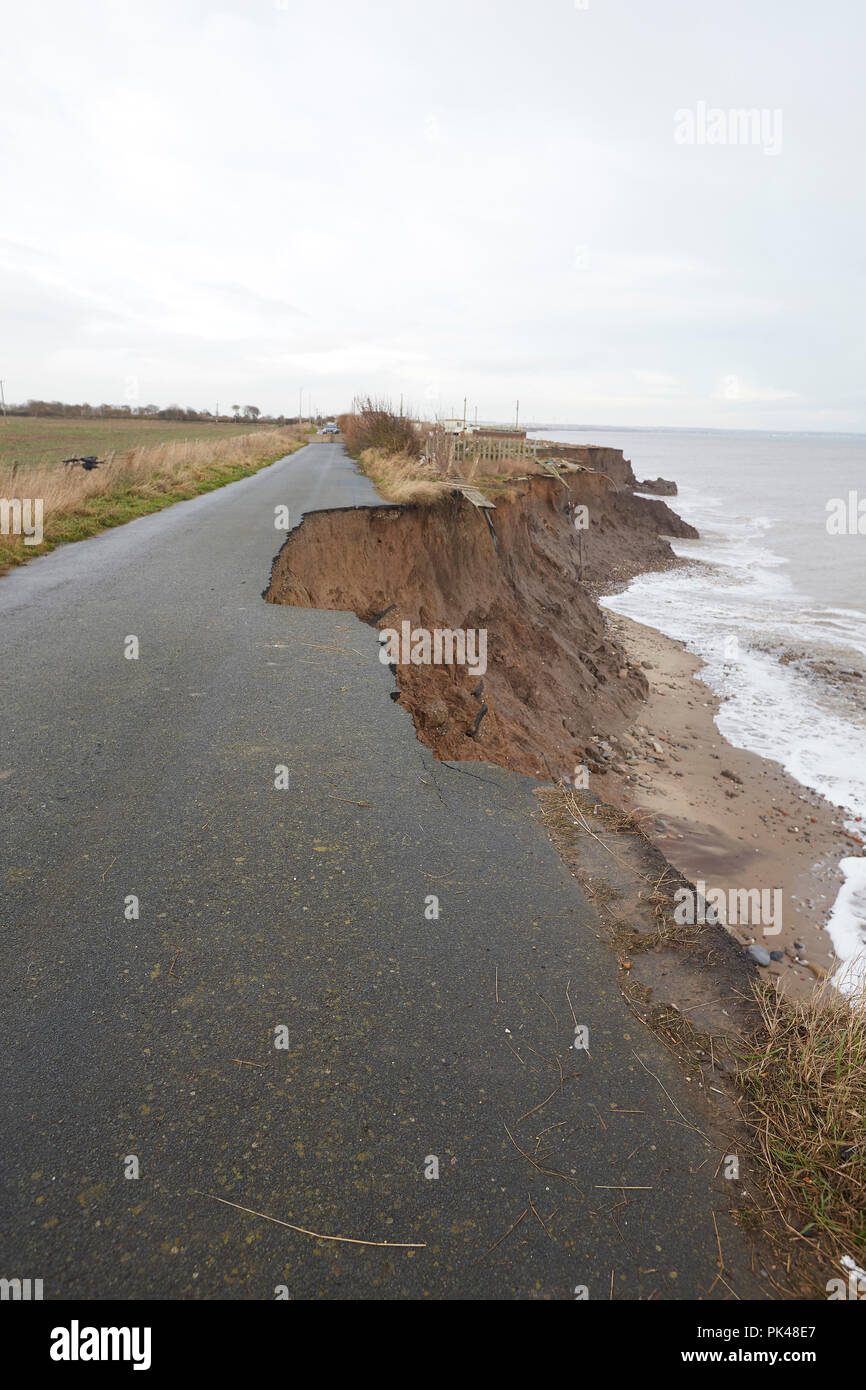 End of the road. Coastal Erosion cliffs, the Ulrome road collapsing into the North Sea, Ulrome, Skipsea, East Riding of Yorkshire, England, UK Stock Photo