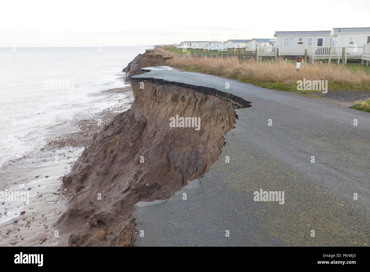 End of the road. Coastal Erosion cliffs, caravans and road collapsing into the North Sea, Ulrome, Skipsea, East Riding of Yorkshire, England, UK Stock Photo