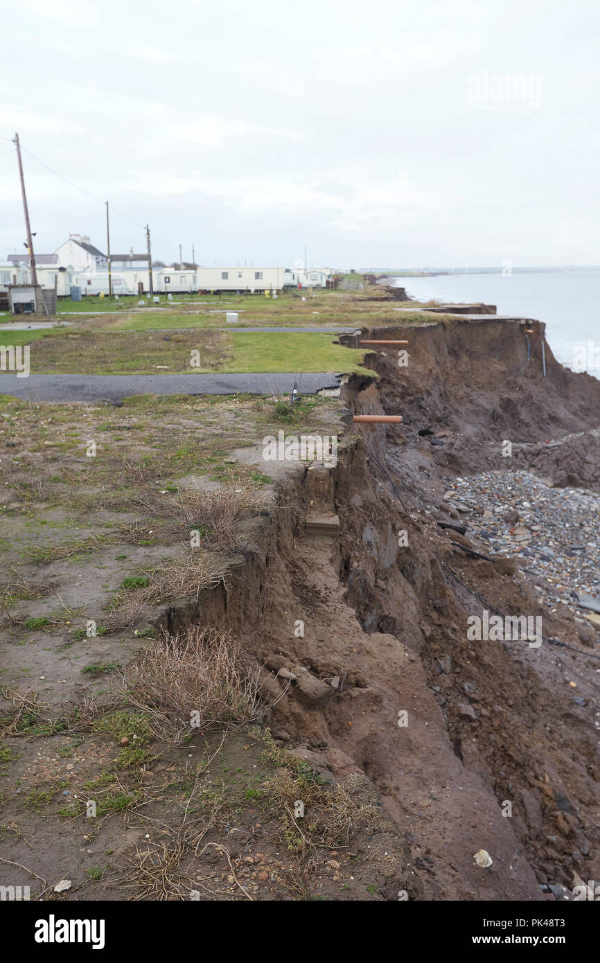 Coastal Erosion cliffs, remains of a caravan site that has collapsed into the North Sea, Ulrome, Skipsea, East Riding of Yorkshire, England, UK Stock Photo
